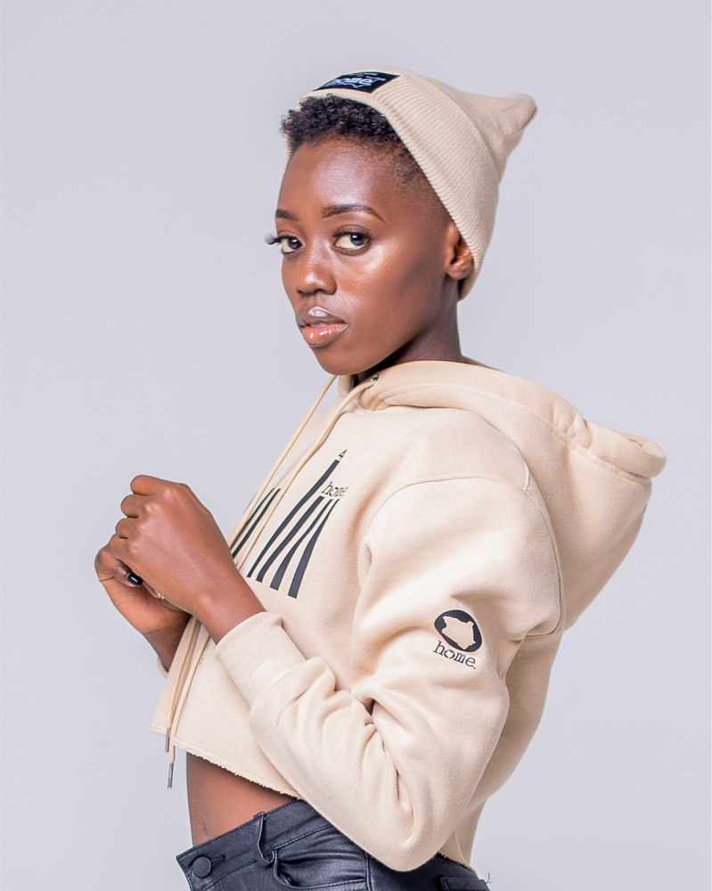 Rue baby in JBEEJURA DESINGZ | home_254 light brown Cropped Hoodie with black bars logo- waist up